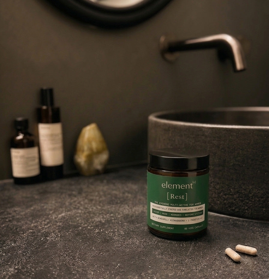 element³ Rest women's evening capsules on a bathroom vanity for sleep and hormone support