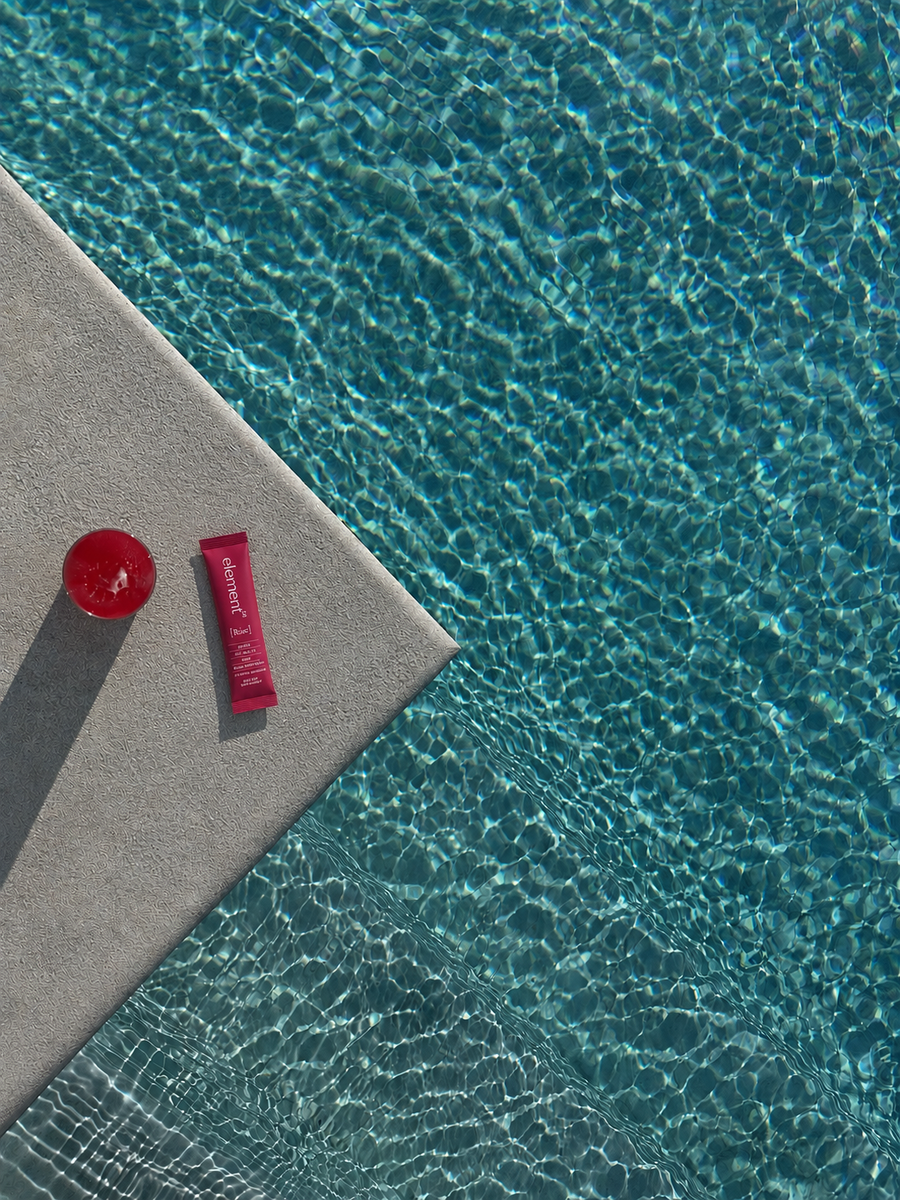 Image of a pool with a glass of element³ Rise women's morning multi-active supplement drink